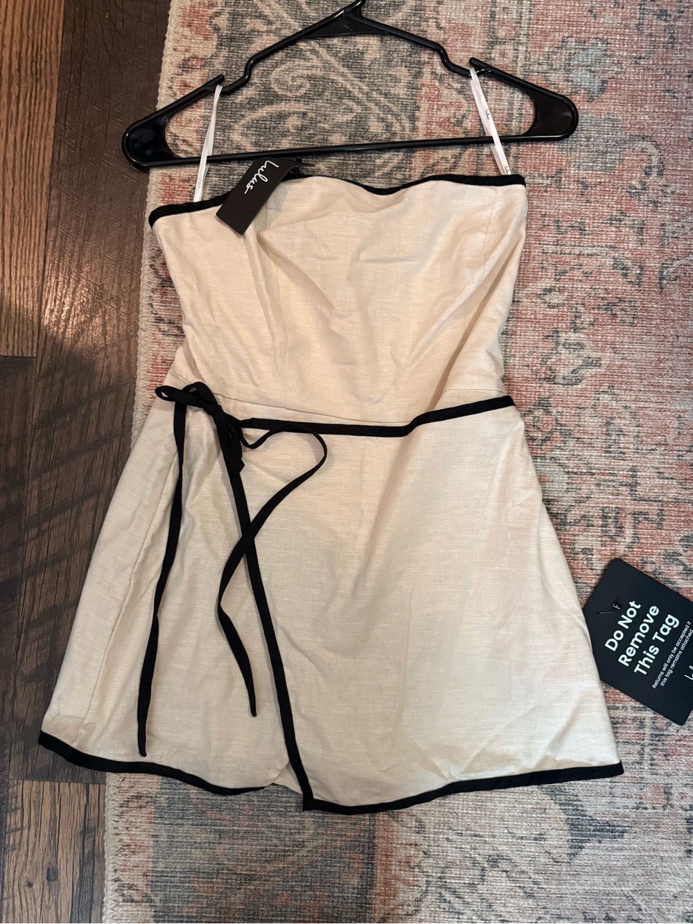 Lulu's Cream Strapless romper with Black Trim